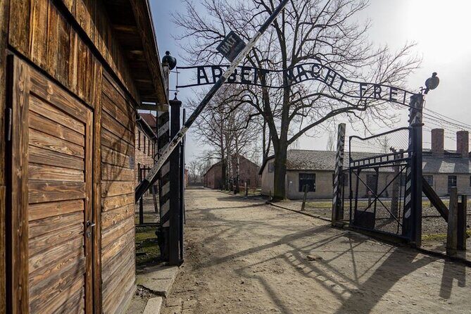 Auschwitz Birkenau Tour with Pickup and Lunch - Auschwitz I: Walking the Iron Gate and Facing Block 11