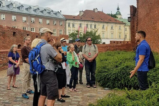 Explore the Stunning Warsaw Old Town, Royal Way & Hidden Gems - Castle Square and the Royal Castle walls: how Warsaw was rebuilt