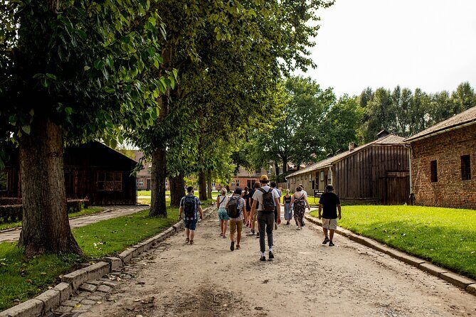 From Krakow: Auschwitz-Birkenau Trip with Transport - Auschwitz I: entering through the gate and learning how to read the site