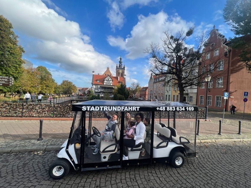 Gdansk: City Tour Live Guided by Golf Cart/Buggy Sightseeing - The crane and the medieval harbor story on the Motława