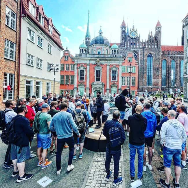 Gdansk: Spy-Themed Walk & Game with Host - Four Lions Fountain start: briefing with a suspicious briefcase