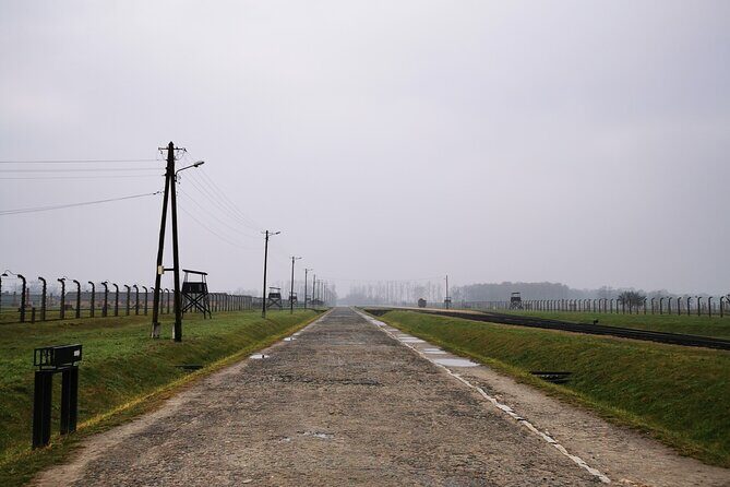 Guided Tour from Krakow to Auschwitz Birkenau with hotel pick up - Auschwitz I: gates, exhibits, and how the guide shapes the visit