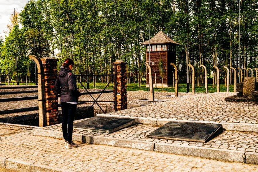 Krakow: Auschwitz-Birkenau Live Guided Tour & Hotel Pickup - Auschwitz I: The Main Gate and What the First Camp Still Tells
