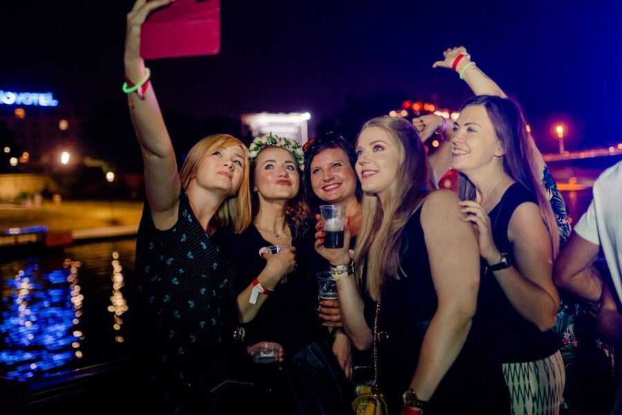 Krakow: Boat Party with Unlimited Drinks - The photo booth and photographer: fun keepsakes, but placement matters