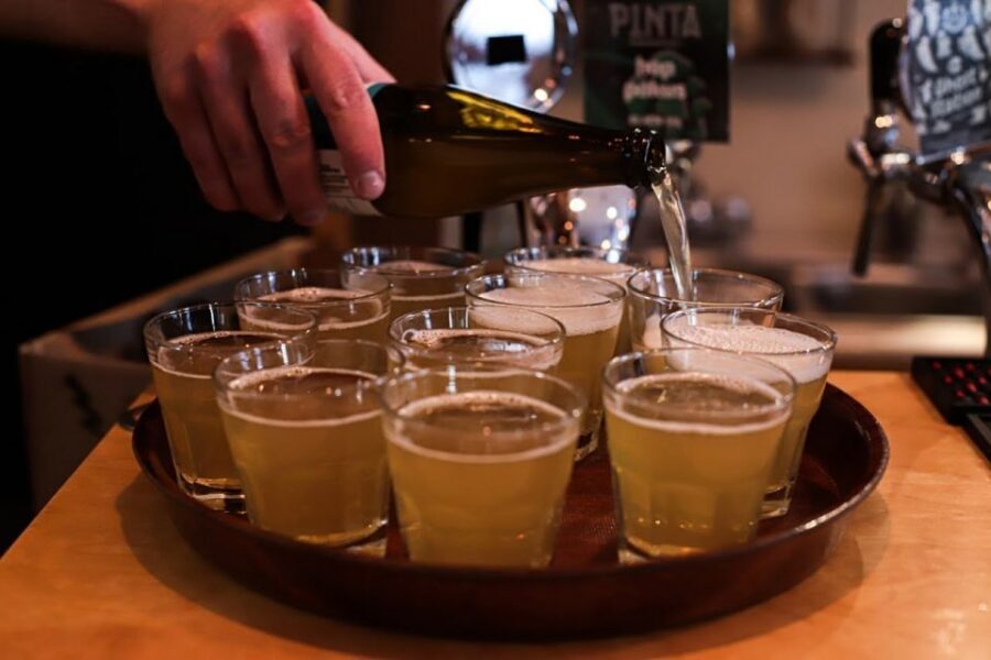 Krakow: Craft Beer Tasting City Walking Tour - Salty snacks, extra drinks, and pacing you should expect