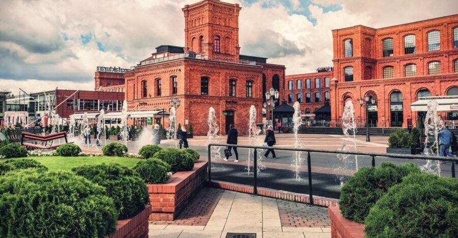 Lodz: Private City Walking Tour - Piotrkowska Street: sculptures, storefront life, and the long promenade effect