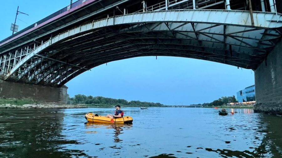 Packrafting kayaking guided tour Vistula river Warsaw Poland - The sunset factor: how the river turns Warsaw cinematic
