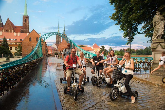 The Grand E-Scooter (3 wheeler) Tour of Wroclaw - everyday tour at 9:30 am - Meeting at Kotlarska 18: helmets, headsets, and rider setup