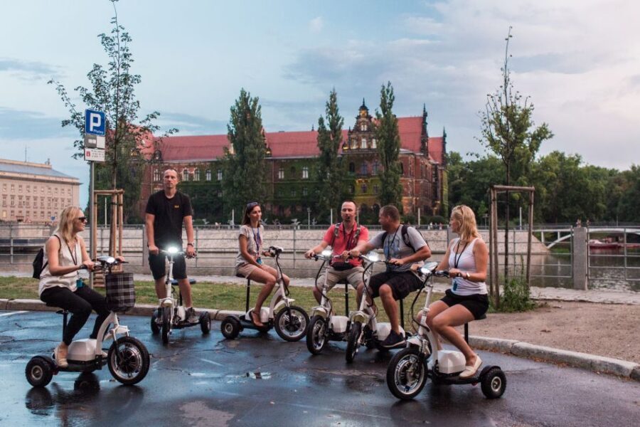 Wroclaw: Grand E-Scooter Tour - How the tour stays safe and comfortable: helmet, headset, and bike-lane riding